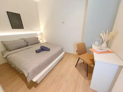 a small bedroom with a bed and a desk at SuperNova Bangsar South Mid Valley Universiti Malaya in Kuala Lumpur