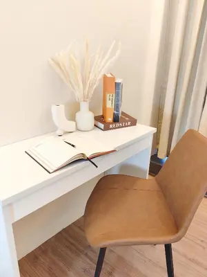 a desk with a chair and a book at SuperNova Bangsar South Mid Valley Universiti Malaya in Kuala Lumpur