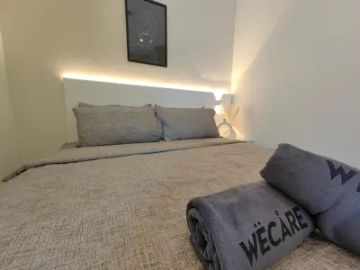 a bedroom with a large bed with a blanket at SuperNova Bangsar South Mid Valley Universiti Malaya in Kuala Lumpur