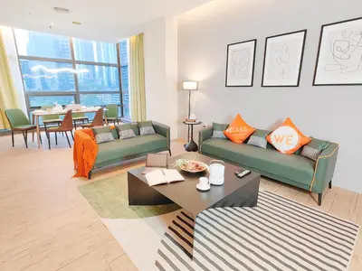 a living room with two couches and a table at SuperNova Bangsar South Mid Valley Universiti Malaya in Kuala Lumpur