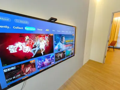 a flat screen tv hanging on a wall at SuperNova Bangsar South Mid Valley Universiti Malaya in Kuala Lumpur