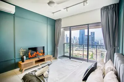 a living room with a fireplace and a large window at Continew Residence KL CoBNB in Kuala Lumpur