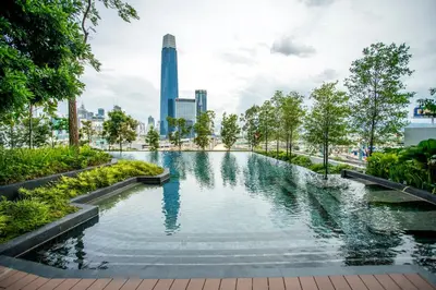a pool in a park with a city in the background at Continew Residence KL CoBNB in Kuala Lumpur