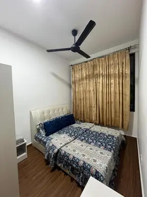 a bedroom with a bed and a ceiling fan at KLVIEW LEGASI KG BARU in Kuala Lumpur