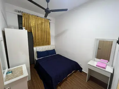 a small bedroom with a bed and a mirror at KLVIEW LEGASI KG BARU in Kuala Lumpur