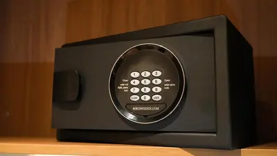 a small black microwave oven sitting on a table at D Loft Hotel in Kuala Lumpur