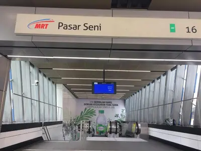 a hallway with a psaexit sign in an airport at D Loft Hotel in Kuala Lumpur