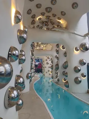 a room with a swimming pool and a mirror at Arte plus by Nicestay in Kuala Lumpur