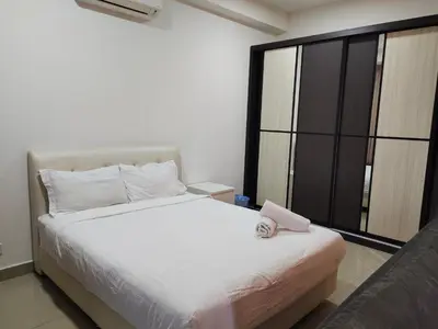 a bedroom with a white bed and a large window at Arte plus by Nicestay in Kuala Lumpur