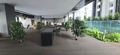 a building with a row of potted trees in a courtyard at M-City Ampang in Kuala Lumpur