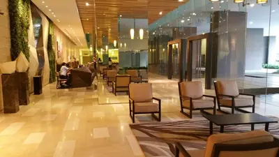 a lobby with chairs and tables in a building at M-City Ampang in Kuala Lumpur