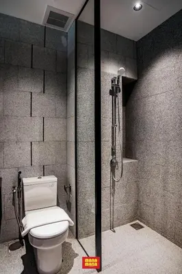a bathroom with a toilet and a shower at Scarletz Mana-Mana Suites KLCC in Kuala Lumpur