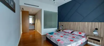 a bedroom with a large bed with a blue ceiling at Anggun Presidential Suites in Kuala Lumpur