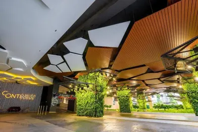 a lobby of a building with plants on the ceiling at Continew Residence by Shuen in Kuala Lumpur