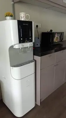 a white refrigerator in a kitchen with a microwave at SCC Velodrome KL in Kuala Lumpur