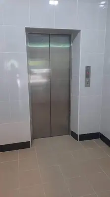 a elevator with a metal door in a room at SCC Velodrome KL in Kuala Lumpur