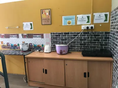 a kitchen counter with pots and pans on it at SCC Velodrome KL in Kuala Lumpur