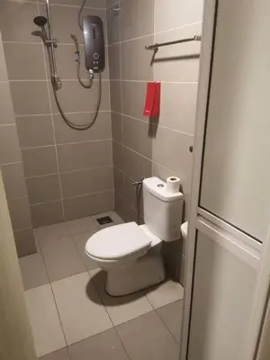 a bathroom with a shower and a toilet in it at SCC Velodrome KL in Kuala Lumpur