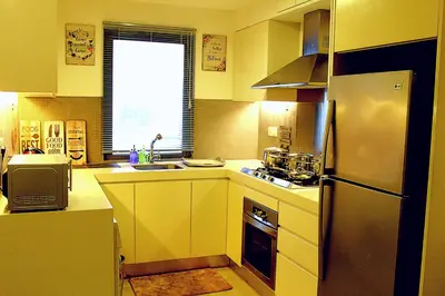 a kitchen with a refrigerator and a sink at D'CASA Fairlane 