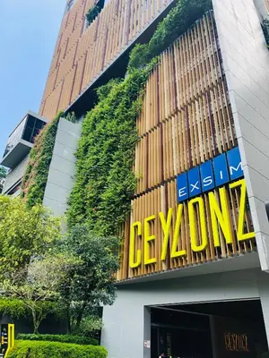 a building with a sign on the side of it at Ceylonz Suites by ROOMY in Kuala Lumpur
