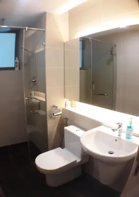 a bathroom with a toilet and a sink and a shower at Blue Sky Apartment in Kuala Lumpur