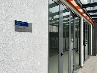 a sign on the side of a building with glass doors at SBR2B Hozem KL1305 Apartment Old Klang Road in Kuala Lumpur