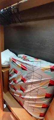 a bed with a bunch of boxes on it at Anggun Platinum Suites in Kuala Lumpur
