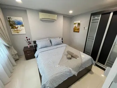 a bedroom with a bed with a towel on it at Dalamanda 3Pax Sunway Velocity Balcony CItyView in Kuala Lumpur
