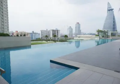 a swimming pool with a city skyline in the background at Lily and Loft - Camellia @ Bangsar Kuala Lumpur in Kuala Lumpur