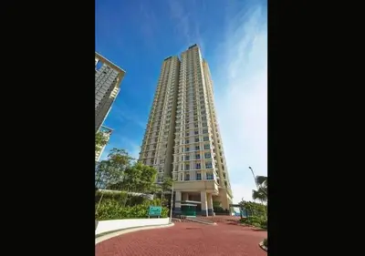 a tall building in front of a blue sky at Lily and Loft - Camellia @ Bangsar Kuala Lumpur in Kuala Lumpur
