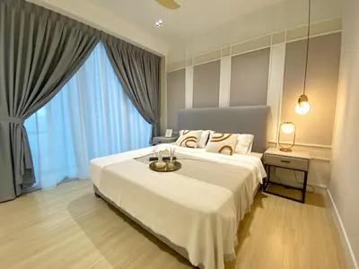 a bedroom with a large white bed and large windows at Lily and Loft - Camellia @ Bangsar Kuala Lumpur in Kuala Lumpur