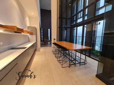 a dining room with a table and a large window at Lucentia Residence World Class Facilities Apartment Infinity Pool Stunning View in Kuala Lumpur