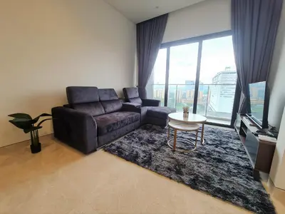 a living room with a couch and a table at Lucentia Residence World Class Facilities Apartment Infinity Pool Stunning View in Kuala Lumpur