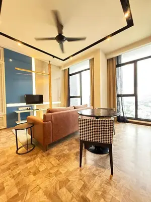a living room with a couch and a table at Expressionz Professional Suites by AURORA SUMMER SUITES in Kuala Lumpur