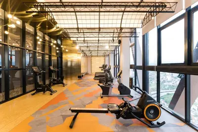 a gym with treadmills and exercise equipment in a building at Scarletz KLCC Studio Suites 4 pax Luxury Modern Style WiFi 100Mbps in Kuala Lumpur
