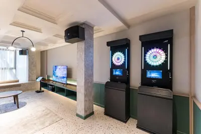 a room with two arcade machines in a room at Scarletz KLCC Studio Suites 4 pax Luxury Modern Style WiFi 100Mbps in Kuala Lumpur