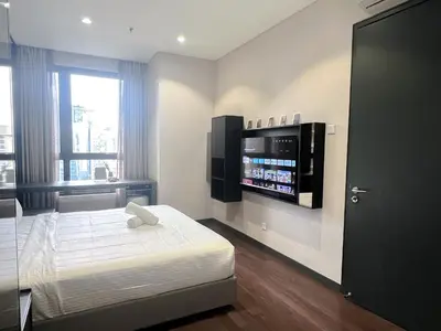 a bedroom with a bed and a flat screen tv at 8 Kia Peng Residence Kuala Lumpur by Scape Stay in Kuala Lumpur
