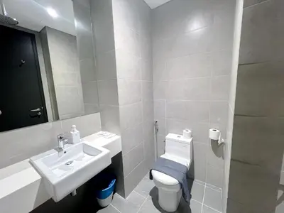 a white bathroom with a sink and a toilet at 8 Kia Peng Residence Kuala Lumpur by Scape Stay in Kuala Lumpur