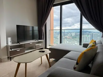 a living room with a couch and a large window at Lucentia Residence BBCC Lalaport at Kuala Lumpur By Luxe Home in Kuala Lumpur