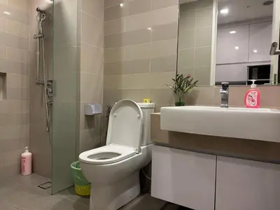 a bathroom with a toilet and a sink at One Bukit Ceylon by Home Suites in Kuala Lumpur