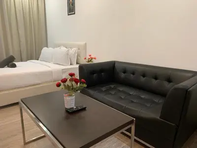 a living room with a couch and a coffee table at RS Suites In Bukit Bintang in Kuala Lumpur