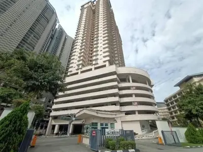a large building in front of two tall buildings at The Orion @Next to IJN 3 Bedroom Unit in Kuala Lumpur