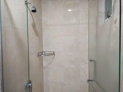 a shower with a glass door with a basketball at The Orion @Next to IJN 3 Bedroom Unit in Kuala Lumpur