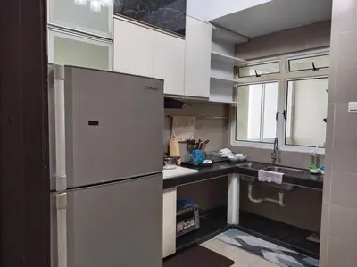 a kitchen with a stainless steel refrigerator and a window at The Orion @Next to IJN 3 Bedroom Unit in Kuala Lumpur