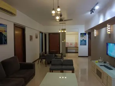 a living room with a couch and a table at The Orion @Next to IJN 3 Bedroom Unit in Kuala Lumpur