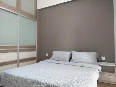 a bedroom with a bed with two pillows on it at The Orion @Next to IJN 3 Bedroom Unit in Kuala Lumpur