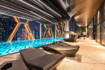 a swimming pool with a view of a city at Scarletz Premier Suites Kuala Lumpur in Kuala Lumpur