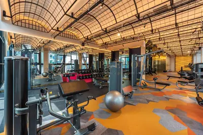 a gym with a lot of treadmills and machines at Scarletz Premier Suites Kuala Lumpur in Kuala Lumpur