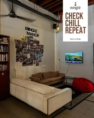 a living room with a couch and a tv at The Manor by Mingle - Poolside Access Next Door in Kuala Lumpur