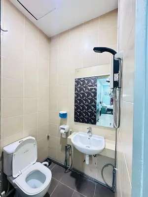 a bathroom with a toilet and a sink at Taragon Homestay - Kuala Lumpur, Malaysia in Kuala Lumpur